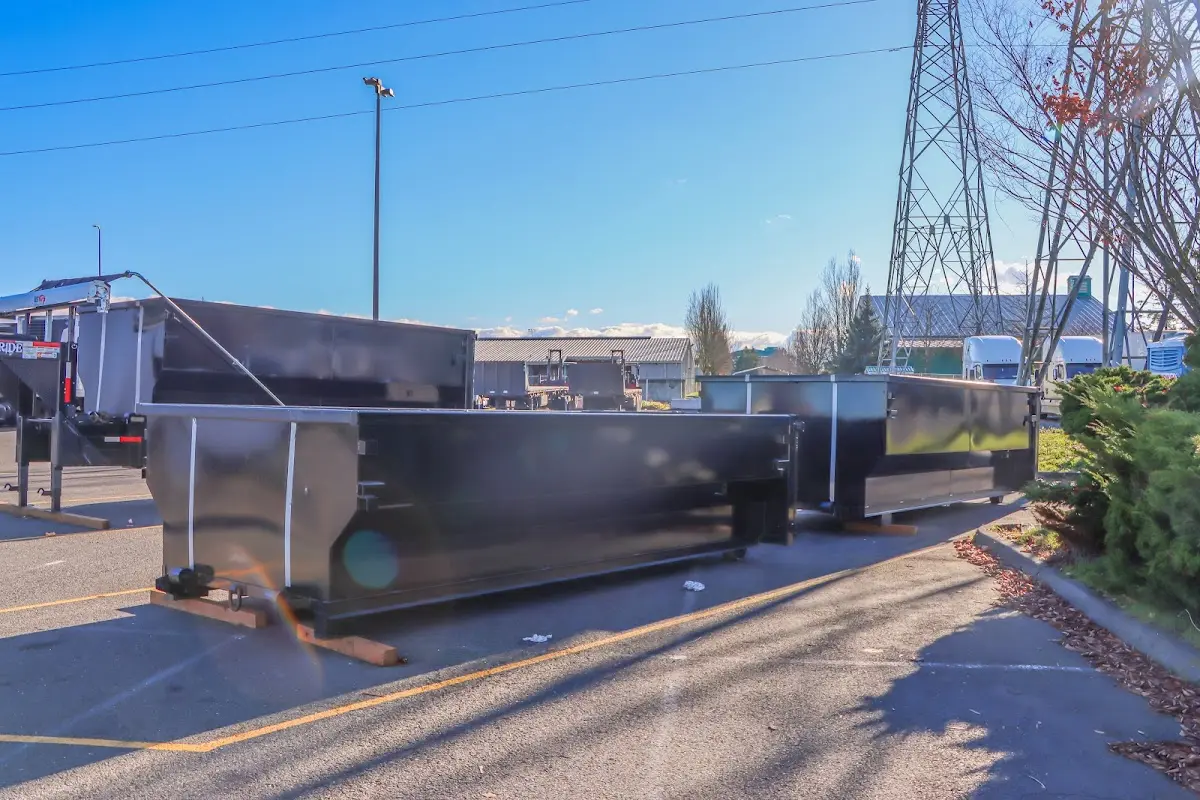 Roll-off dumpster ready for waste disposal at job site for Concrete Dumpster Rental in Pass Christian